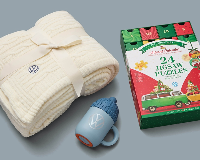 A bathrobe, a box of 24 jigsaw puzzles, and a branded mug