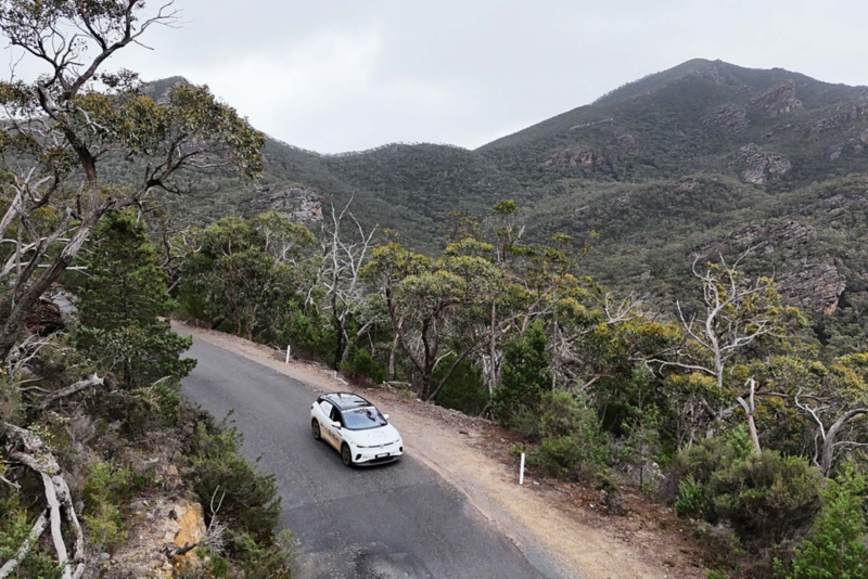 Ariel view of ID.4 driving through mountains