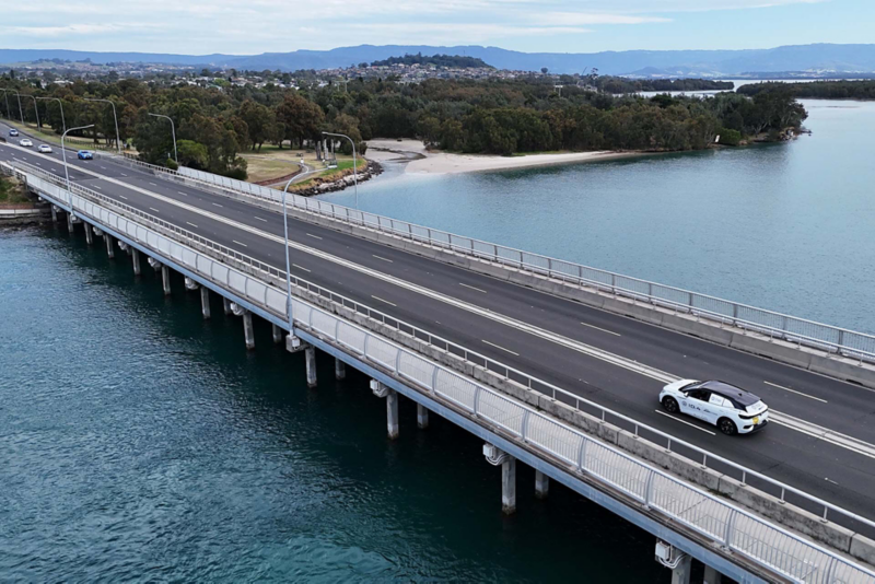 ID.4 driving over water across bridge