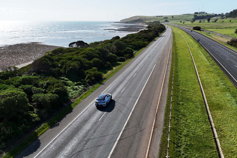 ID.4 driving on the road with ocean to the left 