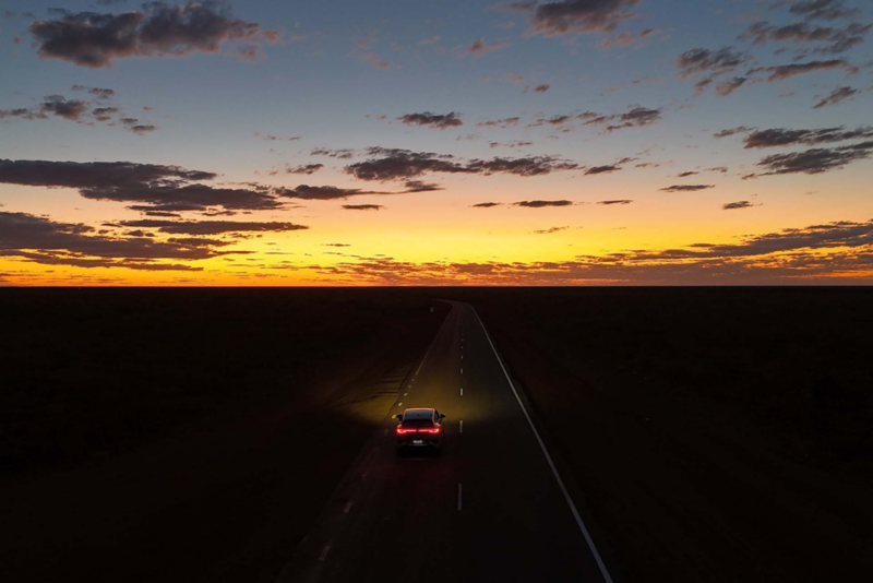 Ariel view of ID.4 driving at sunset