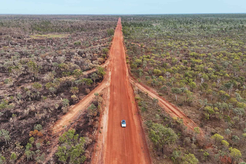 Ariel view of ID.4 driving through bushland