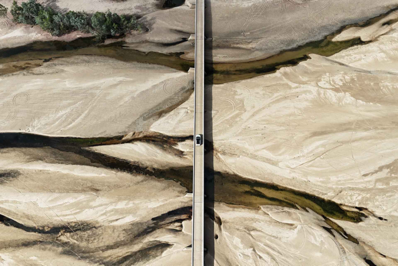 Birds eye view of the ID.4 driving through rocky desert landscape