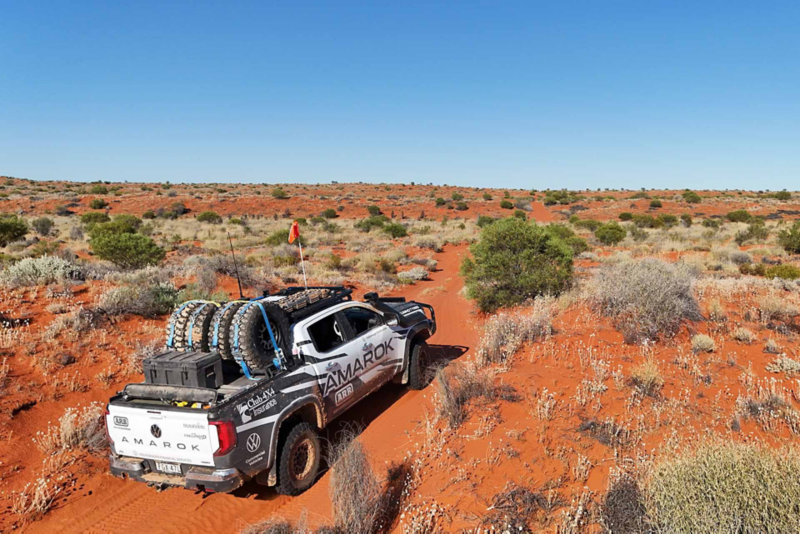Amarok driving through dirt track in the desert