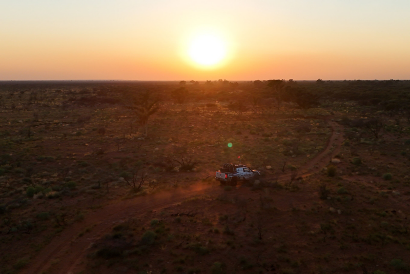 Amarok at sunset driving through desert
