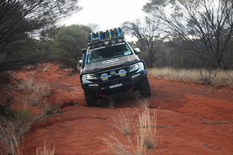 Amarok driving on rocky red desert terrain