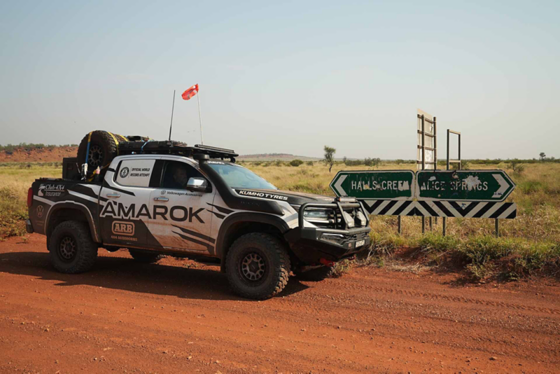 Amarok in desert by signs to Halls Creek & Alice Springs