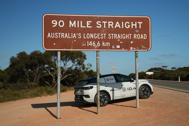 ID.4 underneath Australia's longest straight road sign