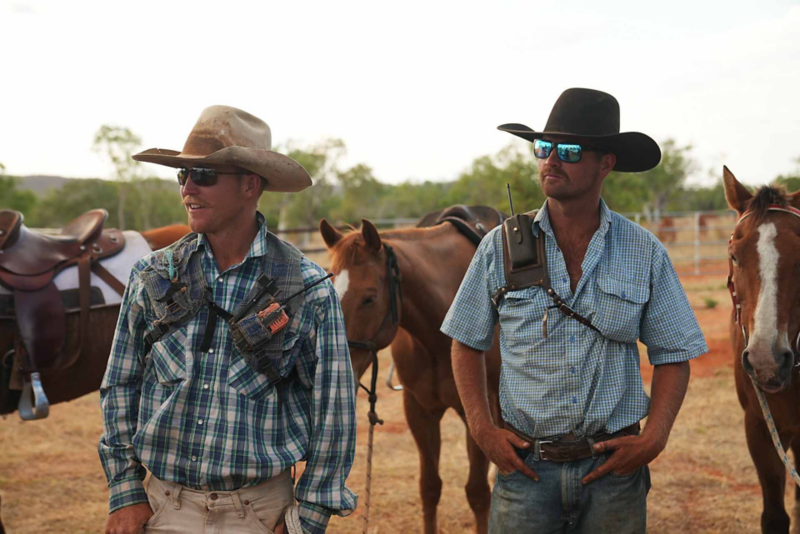 two men with horses