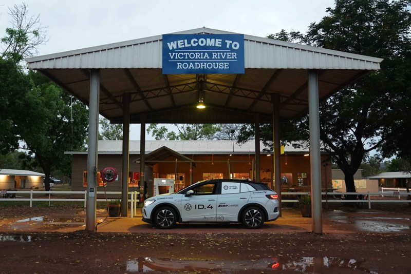Side view of ID.4 underneath Welcome to Victoria River Roadhouse sign
