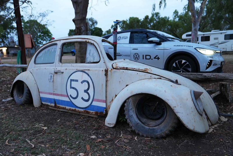 Old vintage VW with ID.4 parked in background