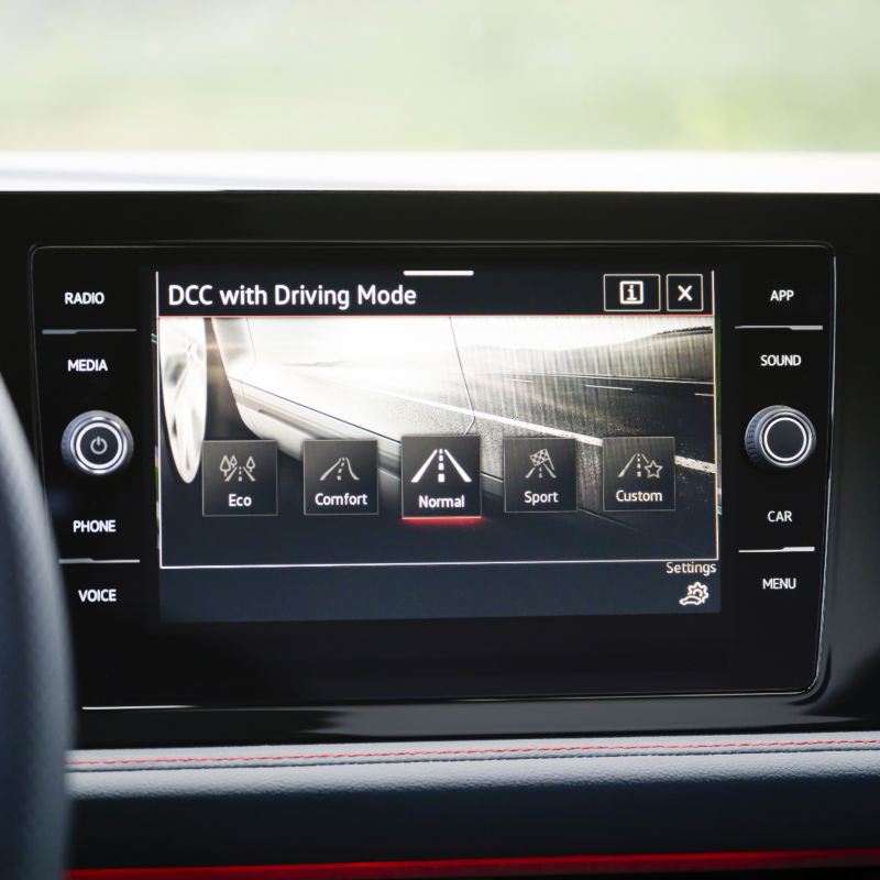 Close-up of the 2025 VW Jetta GLi touchscreen display, showcasing the  Dynamic Chassis Control (DCC) feature.