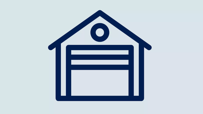 Outline icon of a house with a garage door and a circular window above it.