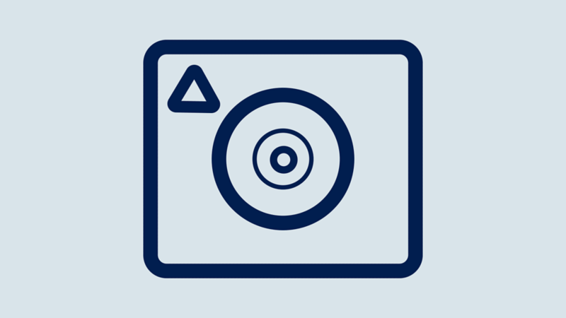 An outline icon of a cars rearview camera washer.