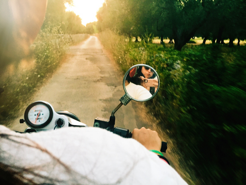 Young people riding on an electric scooter