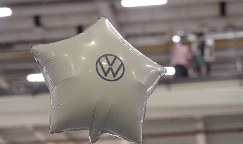 White star shaped balloon with blue VW logo