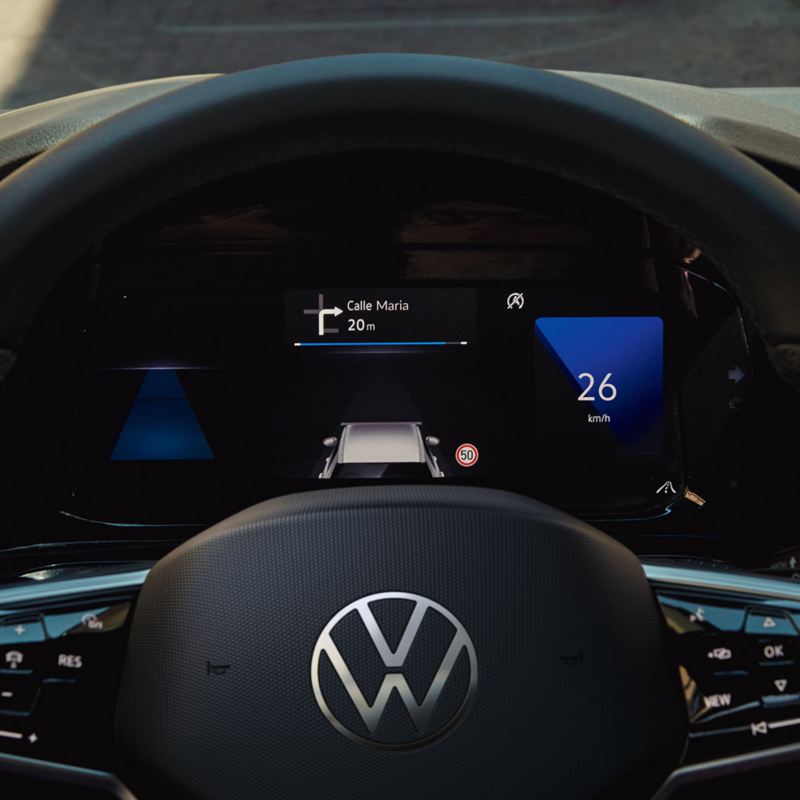Close up of the customisable Digital Cockpit Pro instrument cluster with large colour display in the cockpit of the VW Golf.