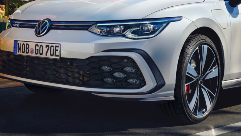 Detailed view of the VW Golf GTE bonnet, front wheel and optional LED fog lights with five-honeycomb design which are integrated in the bumper.