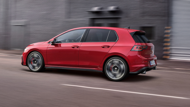 Side view of a red Golf GTI moving.