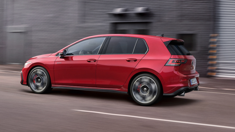 Side view of a red, moving Golf GTI
