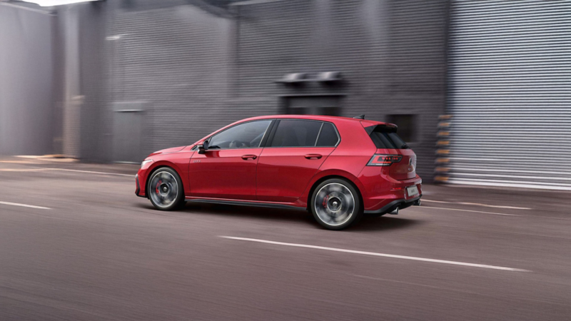 Side view of a Golf GTI in motion.