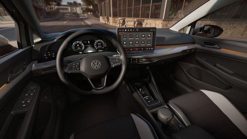 Interior view of the VW Golf with view of the steering wheel and cockpit from the driver's seat.