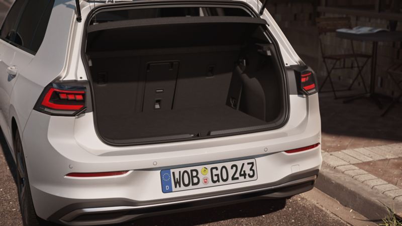 View of the rear of a white VW Golf.