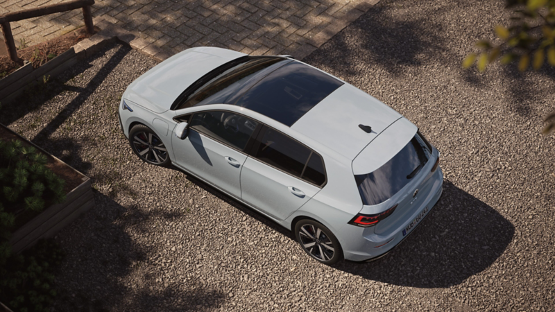 Topview on a white VW Golf GTE with focus on the panoramic sunroof