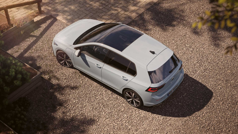 Topview on a white VW Golf GTE with focus on the panoramic sunroof