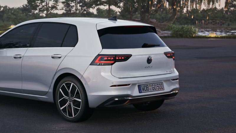 View of the rear of a white VW Golf.