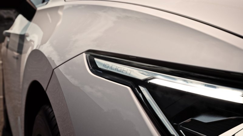 View of the left LED matrix headlight on a white VW Golf.