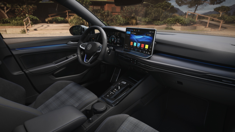 View of the center console and driver's seat of a white VW Golf GTE.