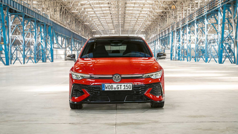 A front shot of a red Golf GTI Edition 50 in a warehouse