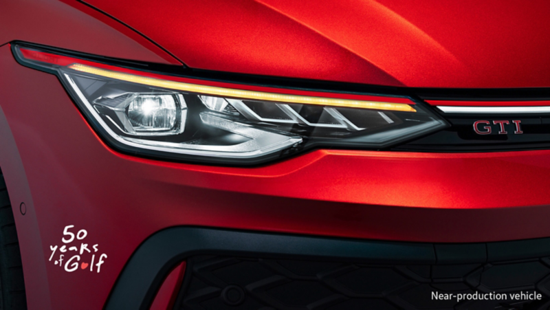 Front close up image of VW headlight with 50 years of golf logo