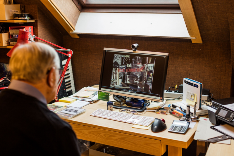 Gerhard Heinz sitting at his desk with computer