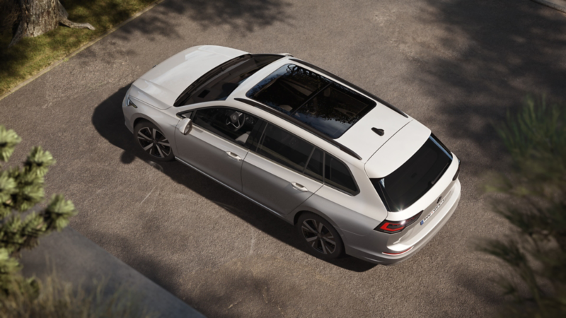 A white Golf Estate is parking. View from above.