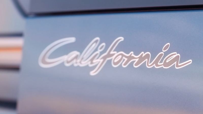 Close up of decal stating 'California' on Volkswagen Caddy California.