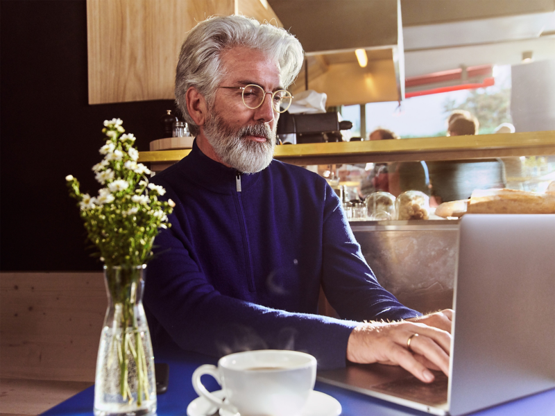 Man sat typing on laptop