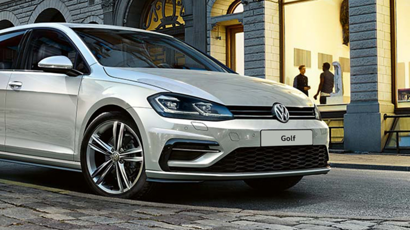 The Silver Volkswagen Golf's headlight