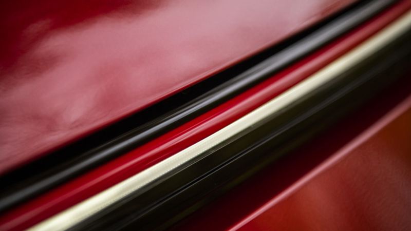 A close up of a red 2024 Golf GTI