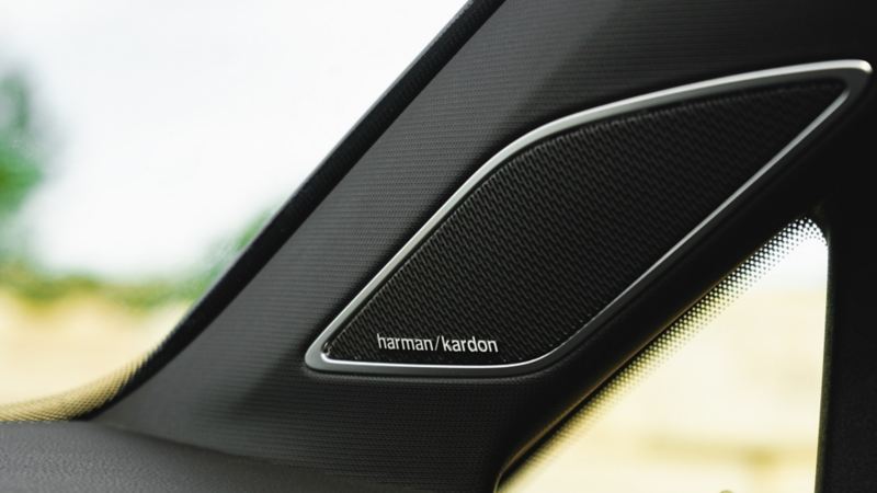 A close up of the Harmon Kardon logo and speaker