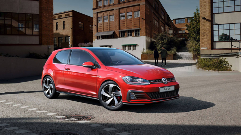 A red Volkswagen Golf GTI parked in the city 