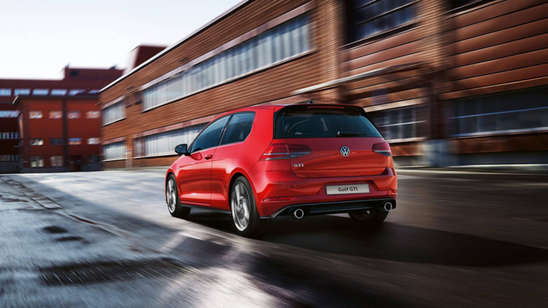 The Golf GTI driving down a road
