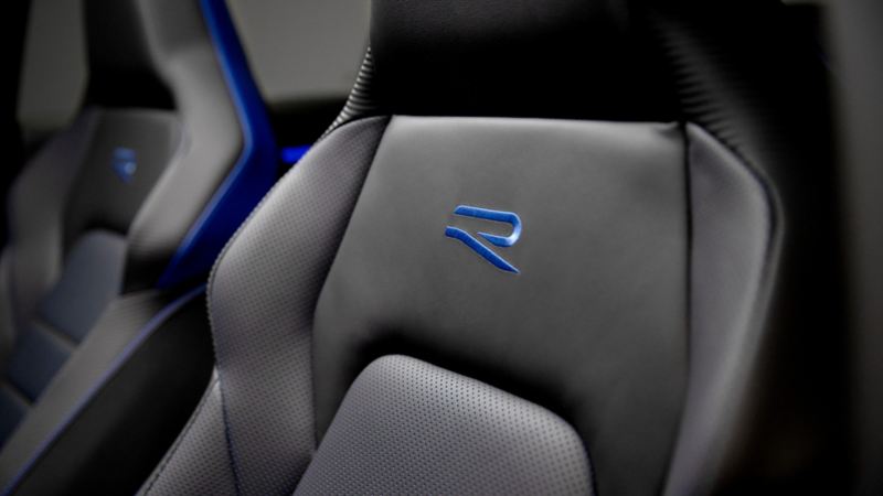The R styling on the black leatherette seat