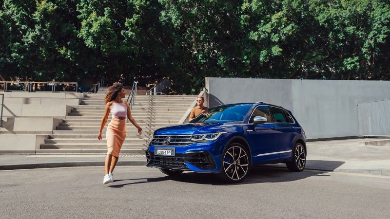 Coup[le approaching a Volkswagen Tiguan R 