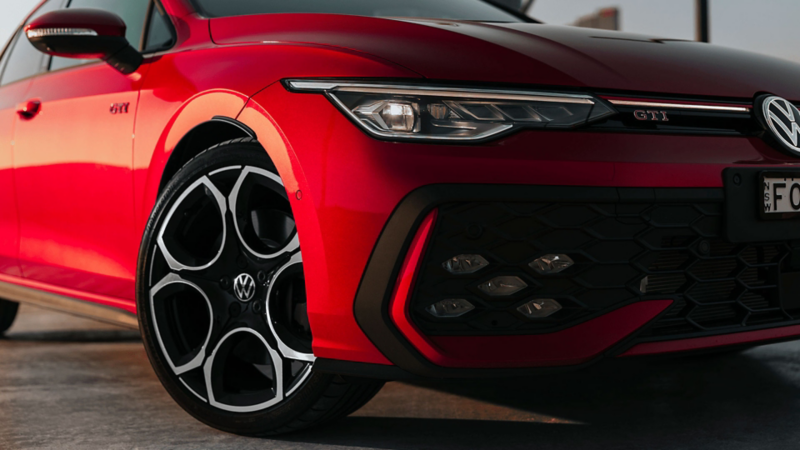 Close up of the front of red GTI