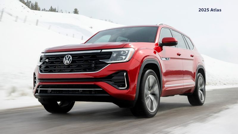 An Aurora Red Chroma VW Atlas Execline on a wintery road.