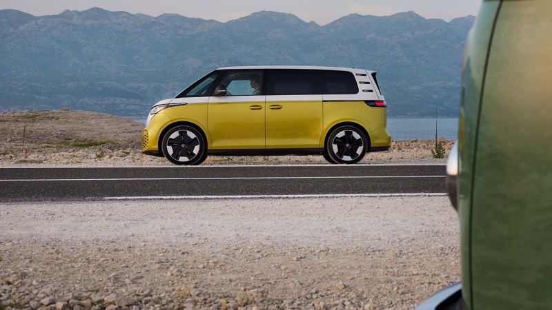 a yellow ID. Buzz driving through mountainous country side