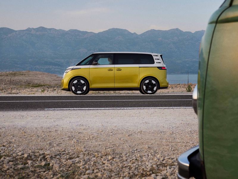 a yellow ID. Buzz driving through mountainous country side