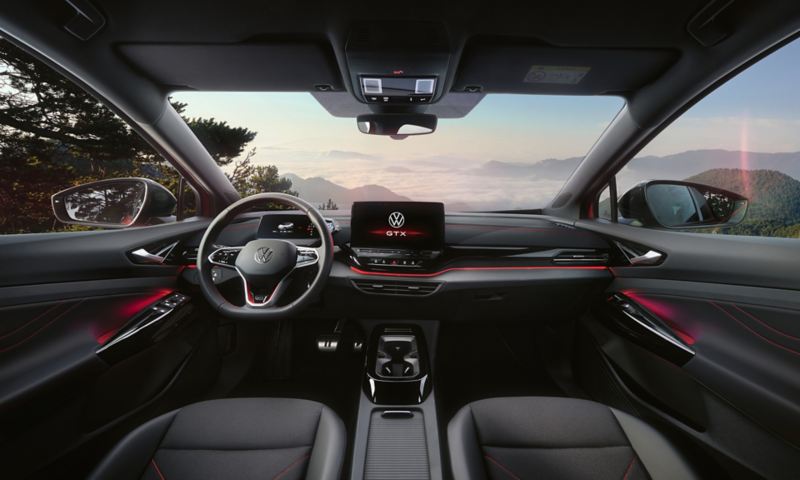 Interior of a red VW ID.5 GTX. View on steering-wheel, Display, seats, dashboard, and rear-view mirror.
